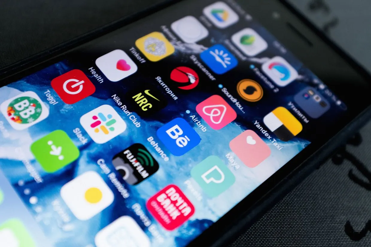 App Development — A smartphone home screen filled with mobile apps