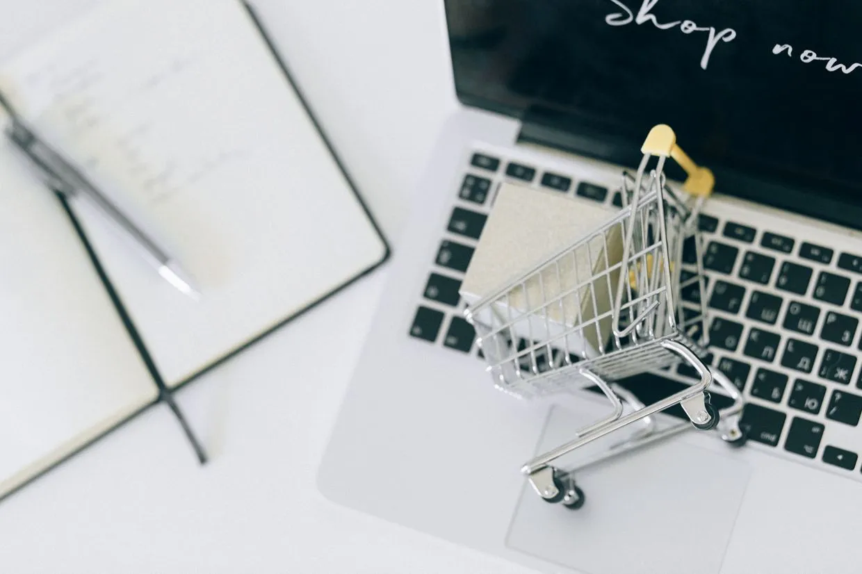Shopify Development — An online store open on a laptop with a shopping cart