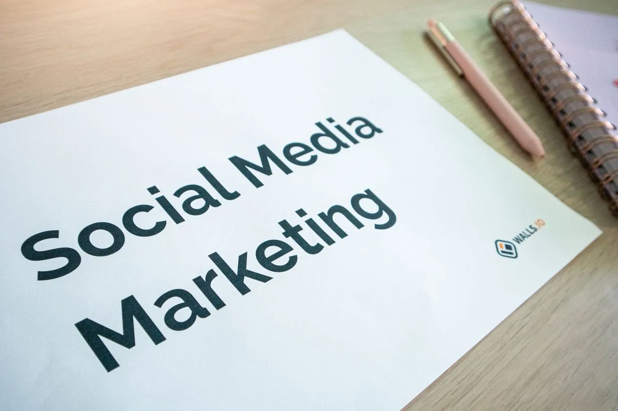 Social Media Marketing — A social media marketing plan laid out on a designer's desk